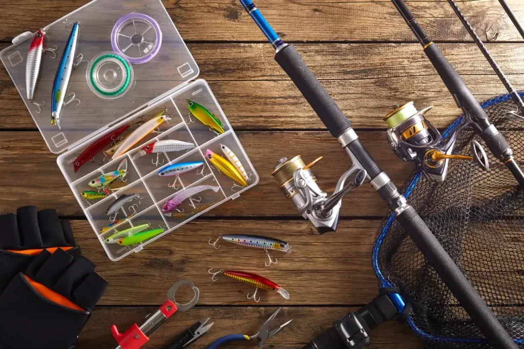 A well-organized fishing setup featuring a spinning rod, reel, and an assortment of lures in a tackle box, perfect for beginner anglers.